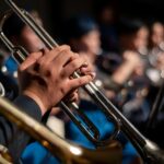 Detailed image of musicians with trumpets during a performance, highlighting musical craftsmanship.